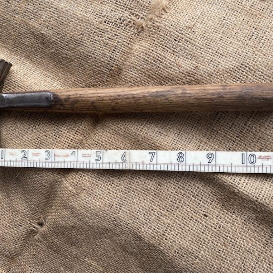 Vintage small strapped claw hammer