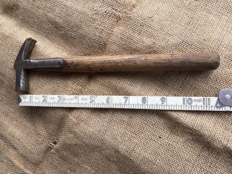 Vintage small strapped claw hammer