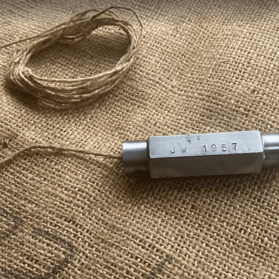 Vintage Artisan made plumb bob marked 1957