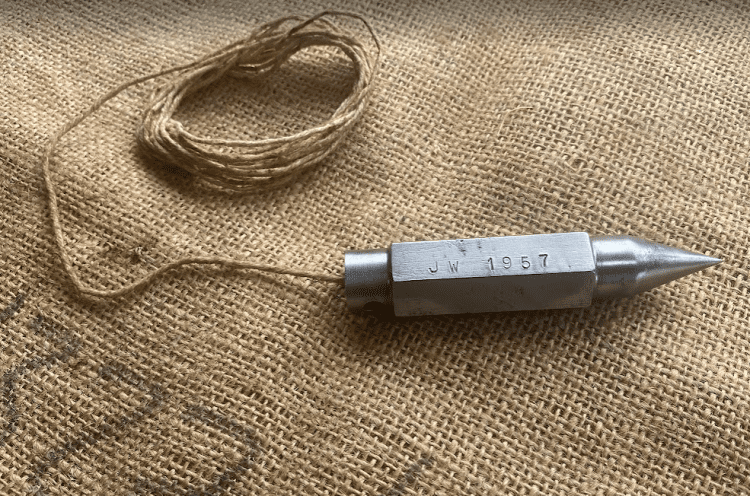 Vintage Artisan made plumb bob marked 1957